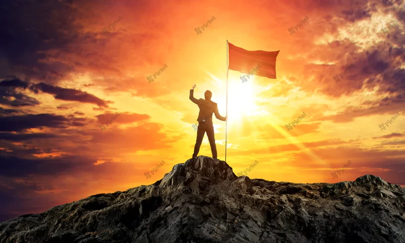 businessman with flag mountain top / مرد با پرچم بالای کوه مفهوم موفقیت