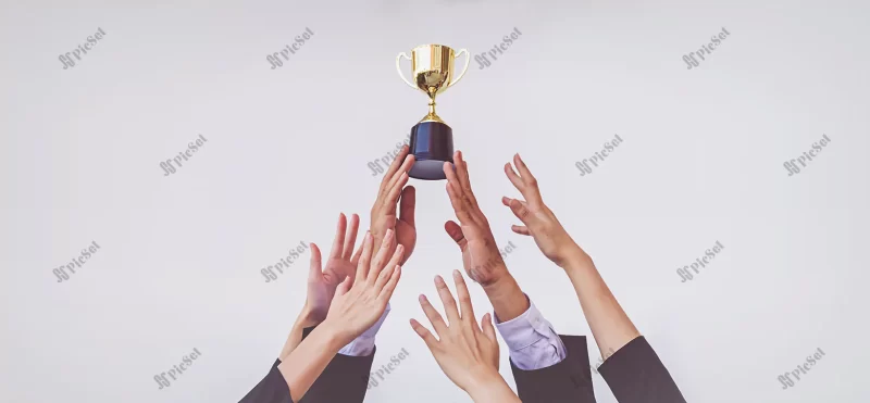 hands scramble golden trophy cup concept business / دست به سمت بالا برای گرفتن جام طلایی مفهوم کسب و کار موفق و برنده