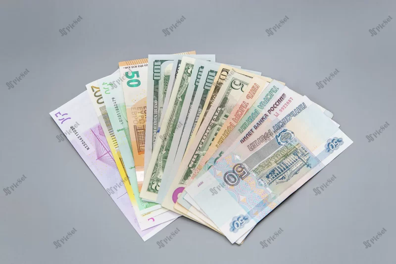 bills euro us dollars russian rubles banknotes gray background saving money / اسکناس یورو دلار آمریکا روبل روسیه پس زمینه خاکستری صرفه جویی در پول سرمایه گذاری مالی
