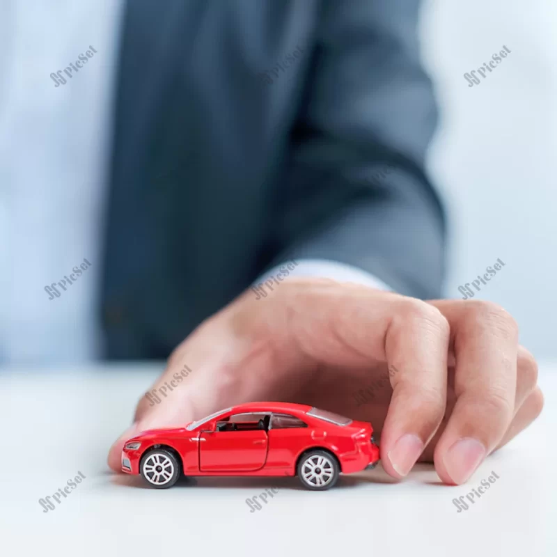 businessman hand holding red car toy car insurance warranty rental financial new repair concept / نگه داشتن ماشین قرمز اسباب بازی بیمه ماشین گارانتی اجاره مالی مفهوم تعمیر سرمایه گذاری جدید