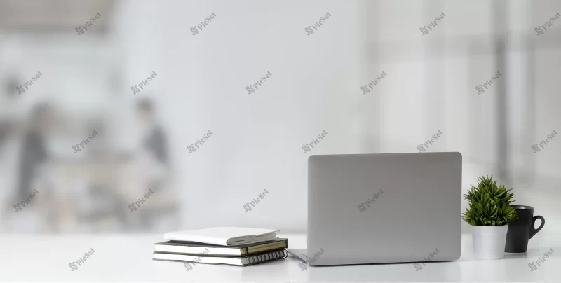 cropped shot open laptop computer wooden table copy space with blurred office / فضای میز چوبی با لپ تاپ و دفتر