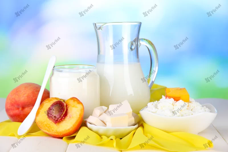 fresh dairy products with peaches wooden table natural background / محصولات لبنی تازه روی میز چوبی شیر و هلو
