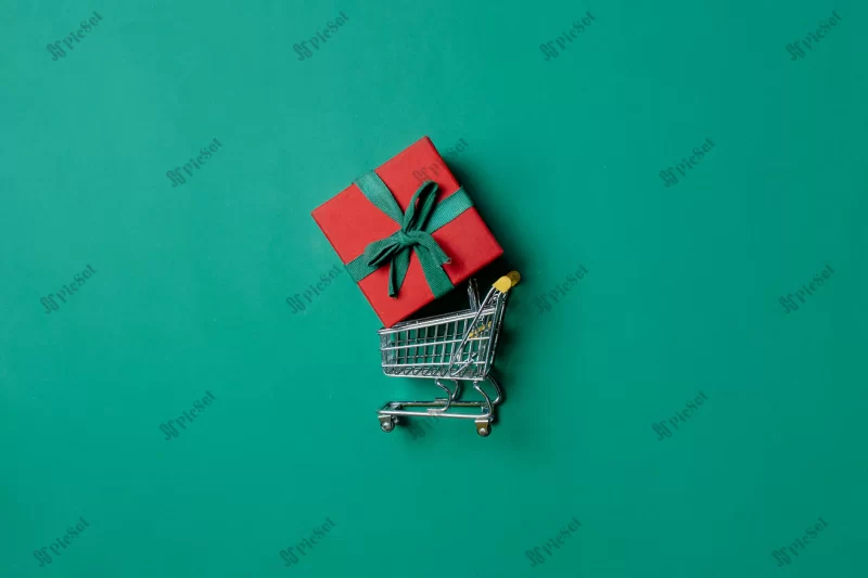 holiday gift box shopping cart paolo veronese green color background view / جعبه هدیه قرمز سبد خرید در تعطیلات پس زمینه رنگ سبز