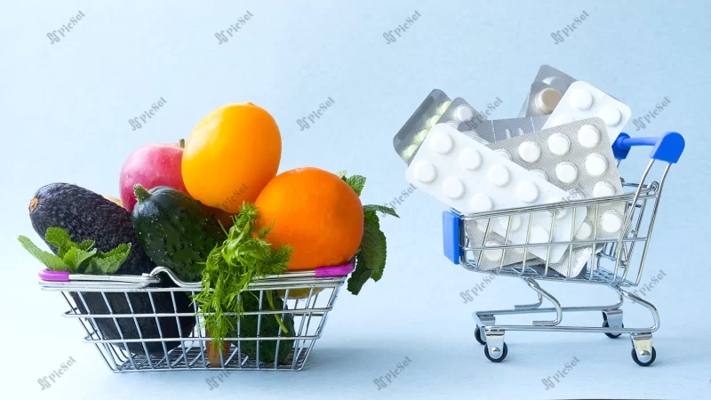 two grocery baskets one is filled with vegetables fruits other is filled with medicines / دو سبد مواد غذایی یکی پر از سبزیجات میوه و دیگری پر از دارو