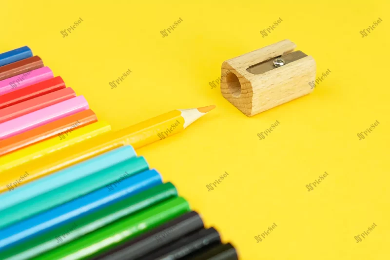 set colored pencils sharpener bright yellow background / تراش و ست مداد رنگی پس زمینه زرد روشن