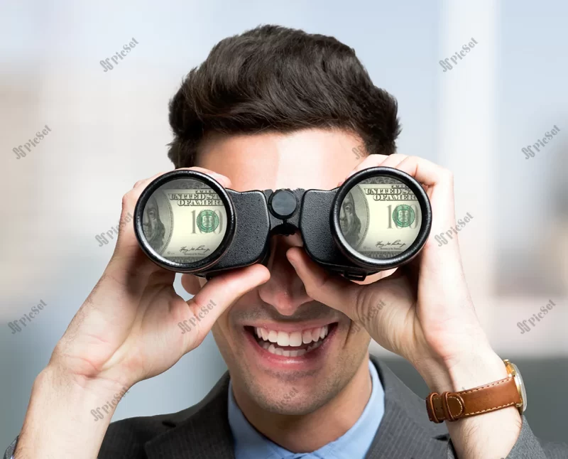 smiling businessman looking dollar banknotes through binoculars / تاجر خندان که با دوربین دوچشمی به اسکناس های دلار نگاه می کند