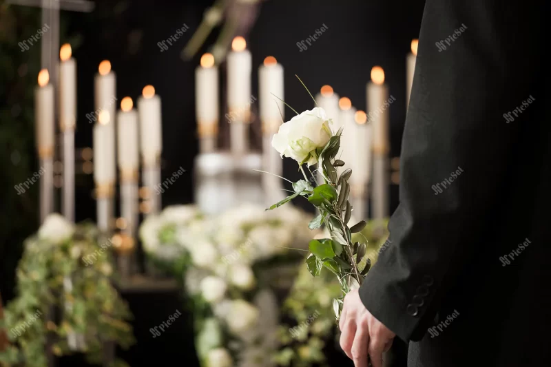 woman holding white flower funeral / مراسم تشییع جنازه با گل سفید و شمع